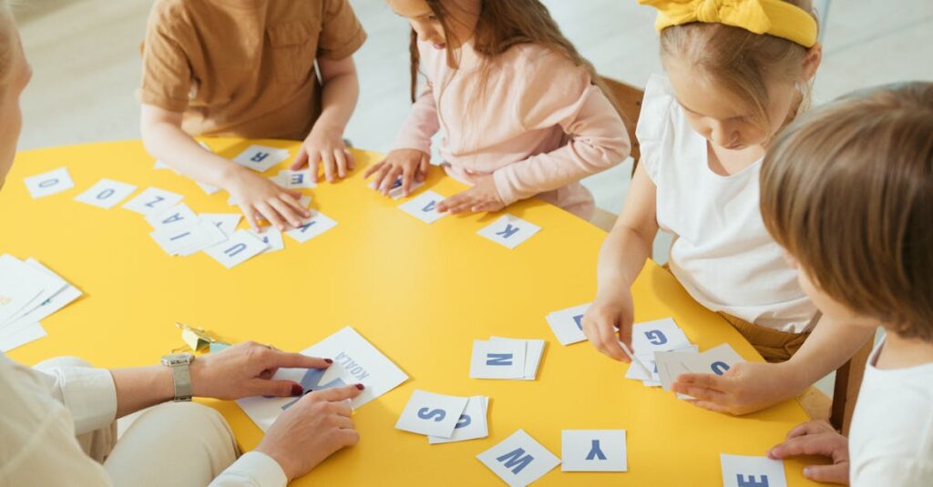 pexels-photo-8087860-8087860 Group of children engaging with alphabet cards on a bright yellow table for learning.